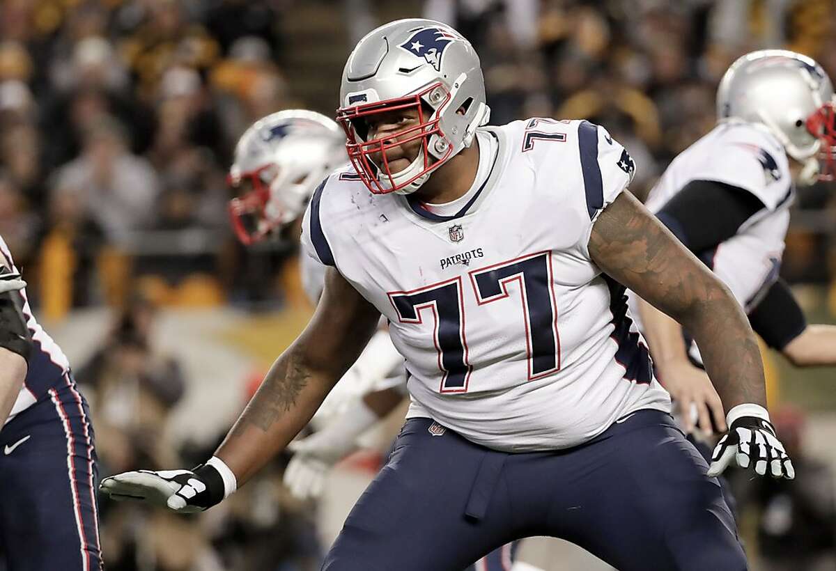 FILE - In this Dec. 16, 2018, file photo, New England Patriots offensive tackle Trent Brown (77) plays against the Pittsburgh Steelers in an NFL football game,in Pittsburgh. The Oakland Raiders have agreed to sign free agent offensive tackle Trent Brown to a four-year deal worth a record $66 million. A person familiar with the contract said Monday, March 11, 2019, that Brown will receive $36.75 million guaranteed in the richest contract ever for an offensive lineman. The person spoke on condition of anonymity because the deal can't be finalized until the new league year starts Wednesday. (AP Photo/Don Wright, File)
