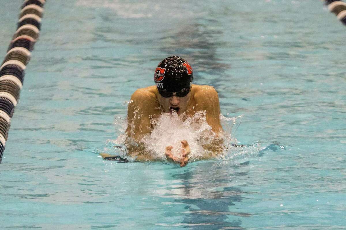 (John Vanacore/For Hearst Connecicut Media) New Canaan's Strider Bennett races the the breast stroke leg in the Class L state chmapionship 200 medley relay.