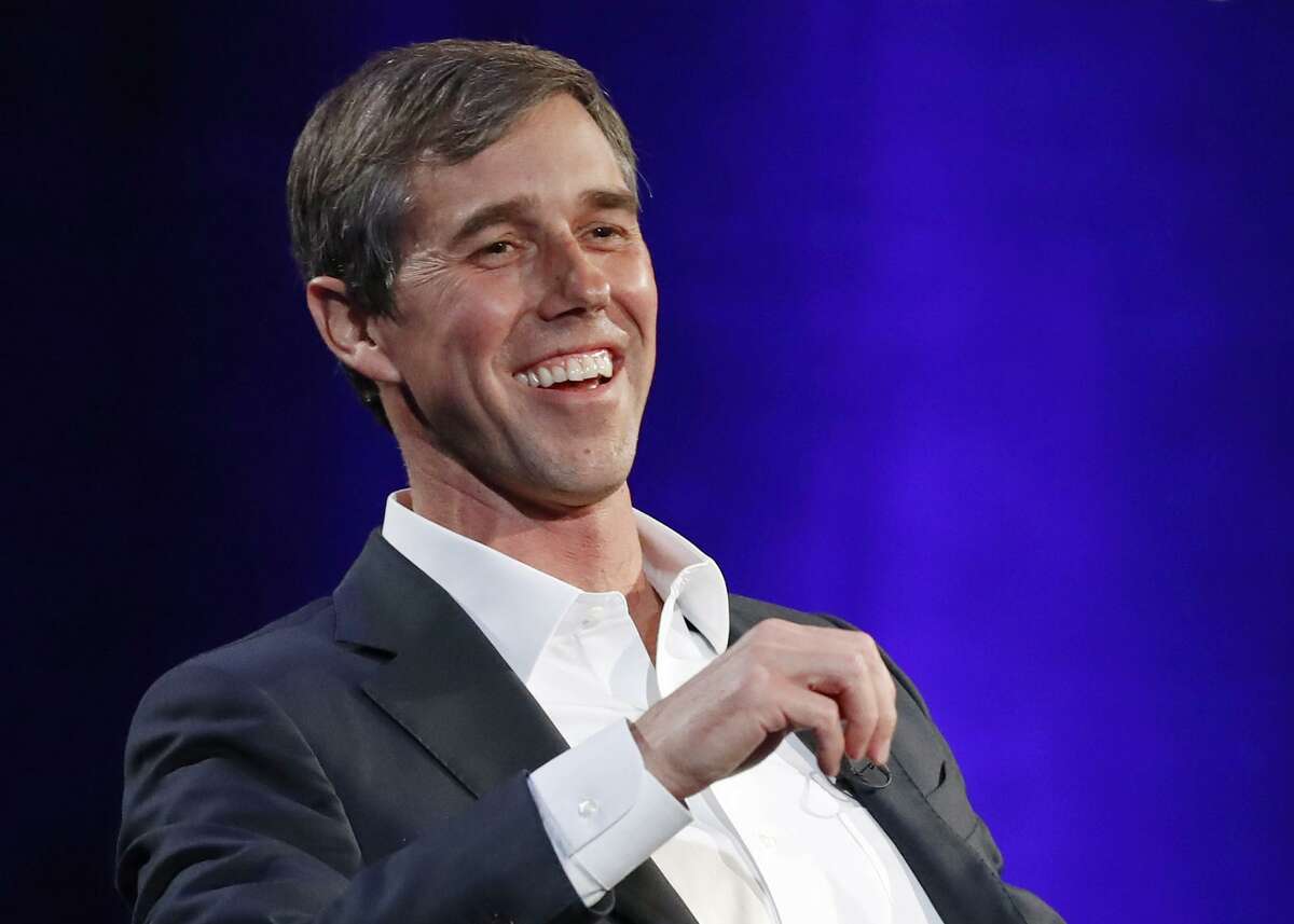FILE - In this Tuesday, Feb. 5, 2019 file photo, former Democratic Texas congressman Beto O'Rourke laughs during a live interview with Oprah Winfrey on a Times Square stage at "SuperSoul Conversations," in New York. The new Beto O’Rourke documentary, “Running With Beto,” ends with him musing about how to keep the momentum of his 2018 defeat in the Texas Senate race going. O’Rourke himself attended the premiere Saturday, March 9, 2019, at South by Southwest, but he also was coy about his future, repeating only that he’ll announce his plans “soon.” (AP Photo/Kathy Willens, File)