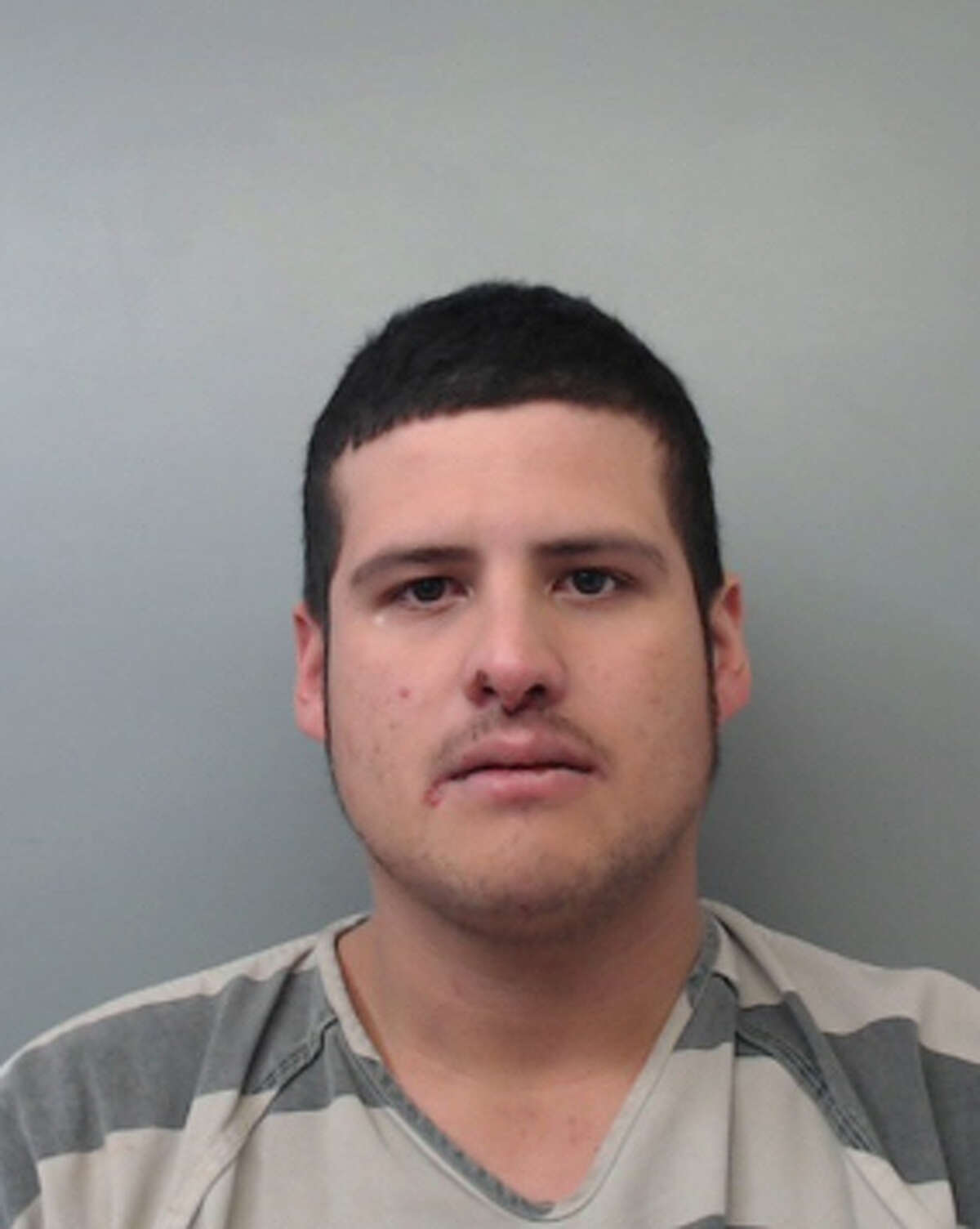 Tomas Rojas Jr., 26, was charged with burglary of habitation, theft of a firearm, aggravated robbery with a firearm and impersonating a public servant.