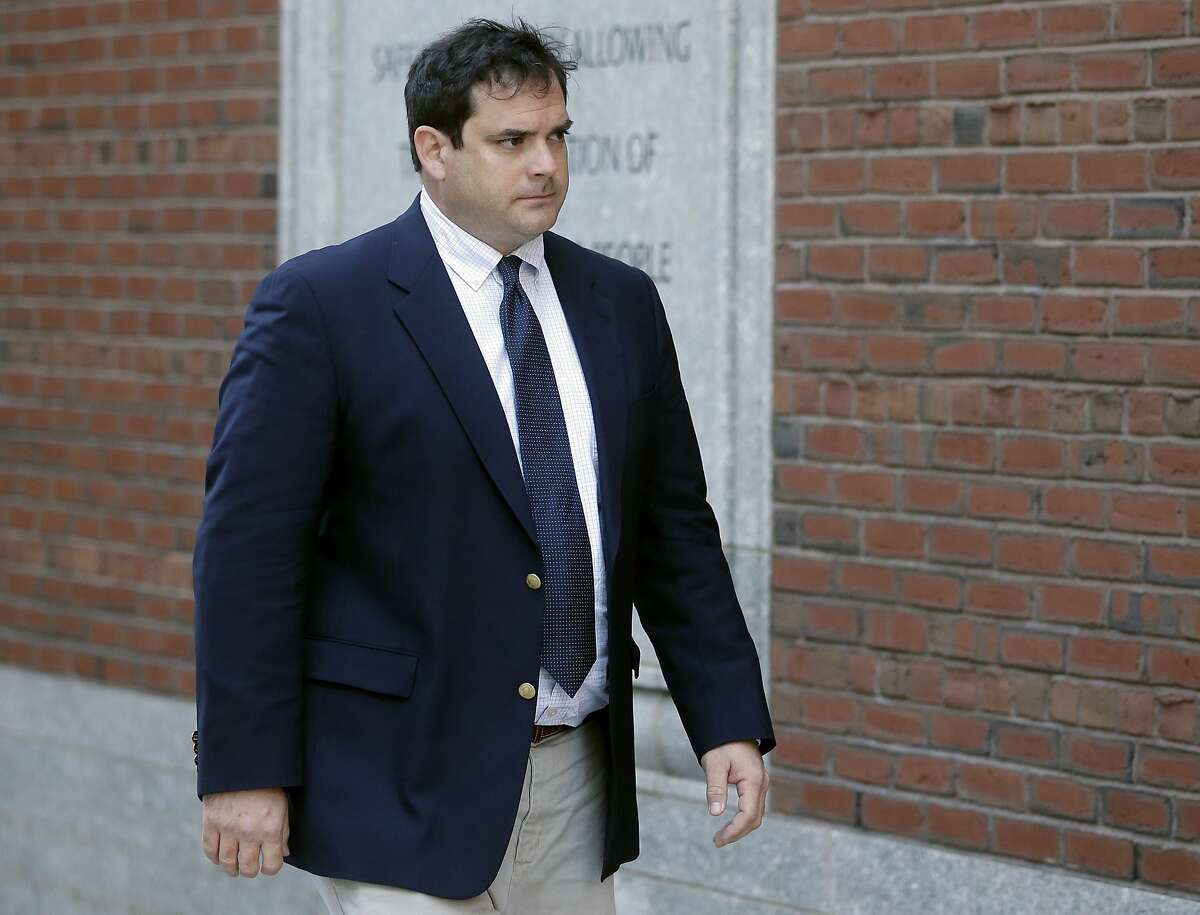 John Vandemoer, former head sailing coach at Stanford, arrives at federal court in Boston on Tuesday, March 12, 2019, where he was expected to plead guilty to charges in a nationwide college admissions bribery scandal. (AP Photo/Steven Senne)