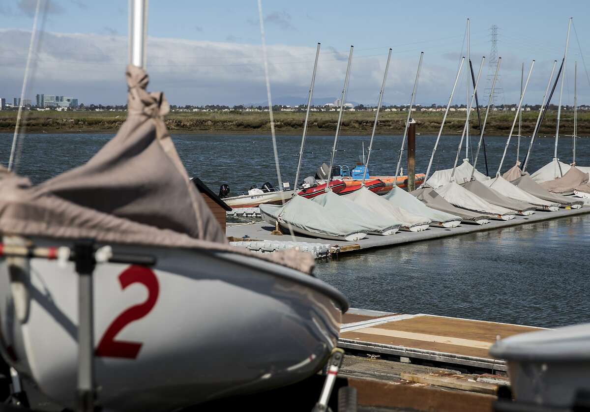 Standford University sailboats are seen docked and covered in the waters near Stanford Rowing and Sailing Center in Redwood City, Calif. Tuesday, March 12, 2019 following the news of Stanford women sailing coach John indictment in a large college admissions bribery scheme.