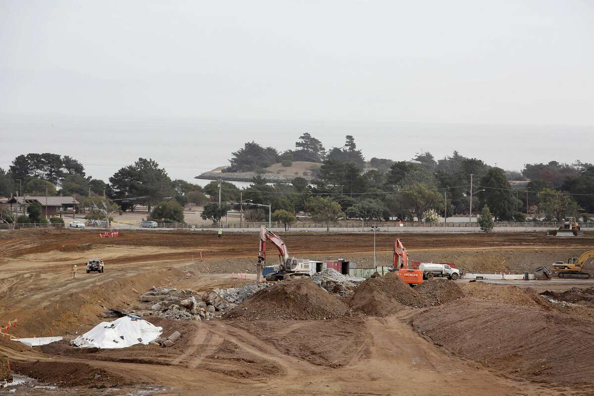 Work is seen being done at the site of where Candlestick Park used to stand with part of Candlestick Point State Recreation Area seen behind it from the deck of Shirley Moore, member of the Bayview Hill Neighborhood Association, Candlestick Point Neighborhood Committee chair and Clear Air Health Alliance president, who says she spends more time on her deck now that her view is unobstructed on Friday, October 23, 2015 in San Francisco, Calif.