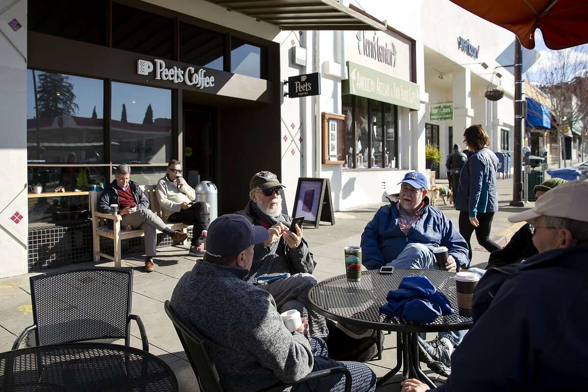 A coffee group meets in front of Peet's Coffee on Solano Avenue in Albany, Calif. on Friday morning, March 9, 2019.