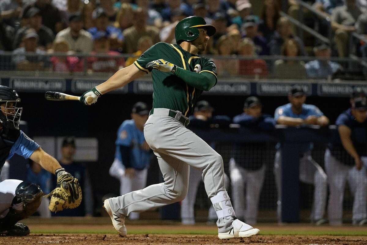 PEORIA, ARIZONA - MARCH 06: Dustin Fowler #11 of the Oakland Athletics singles against the Seattle Mariners during the spring training game at Peoria Stadium on March 06, 2019 in Peoria, Arizona. (Photo by Jennifer Stewart/Getty Images)