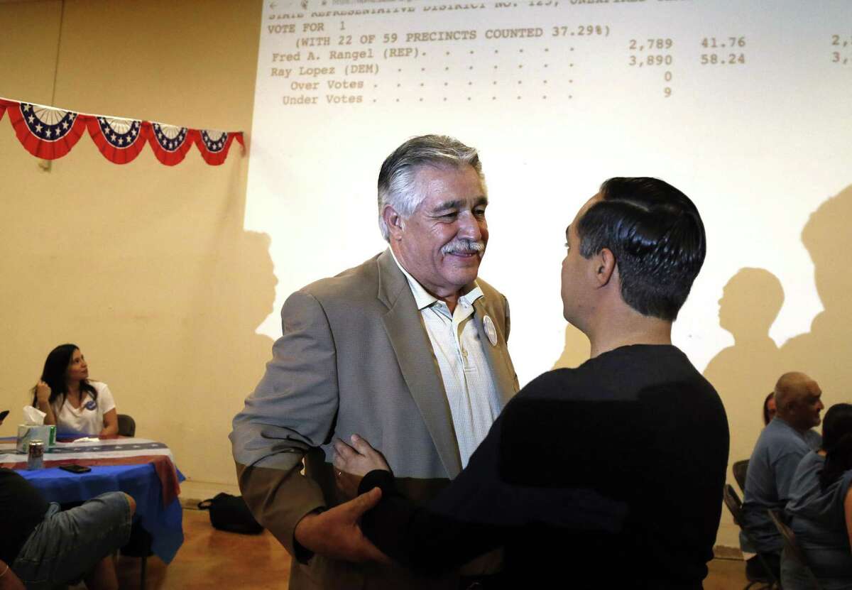 Democrat Ray Lopez is greeted by former San Antonio Mayor Julián Castro at Lopez’s campaign headquarters as early votes give Lopez a big lead in the runoff for Texas House District 125.
