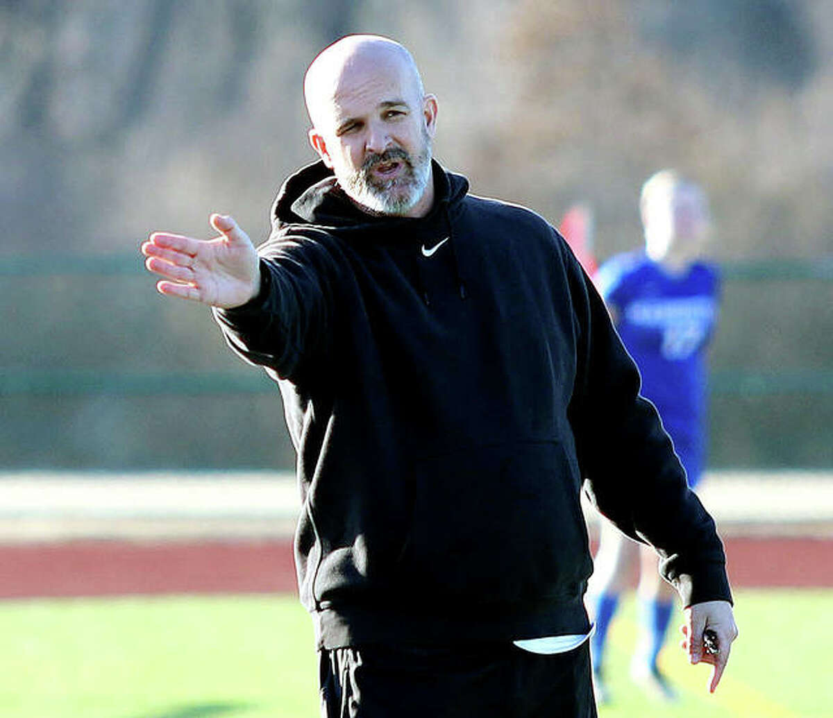Marquette Catholic girls soccer coach Brian Hoener’s team dropped a 3-0 decision to Belleville Althoff in pool play action of the Metro Cup tourney Tuesday night at Althoff. Hoener is shown giving his teams instructions during Monday;s game against Belleville West.