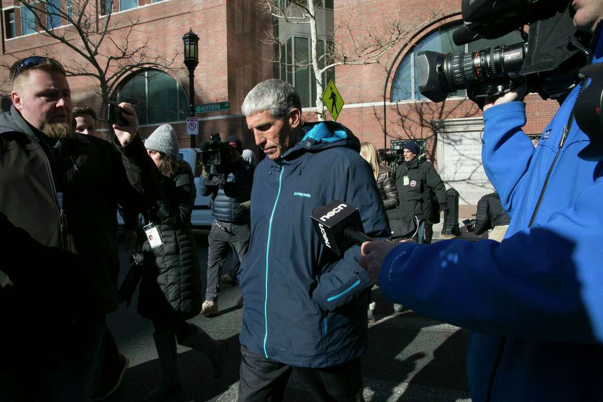 William Rick Singer leaves the federal courthouse in Boston after pleading guilty to charges related to college admission schemes, March 12, 2019. Singer allegedly fabricated athletic ?profiles? of students to submit with their college applications, which contained teams the students had not played on and fake honors not won. (Katherine Taylor/The New York Times)