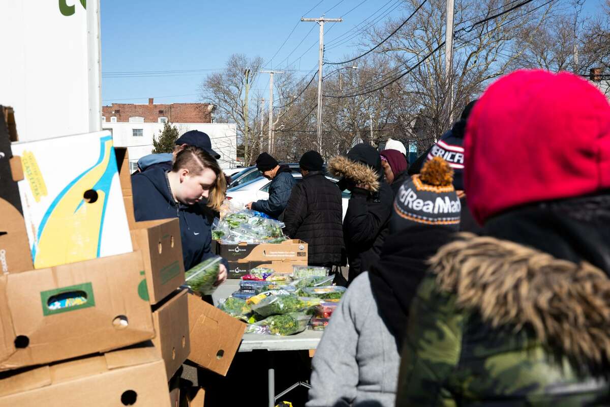 Volunteers for The Connecticut Food Bank unload produce in New Haven.