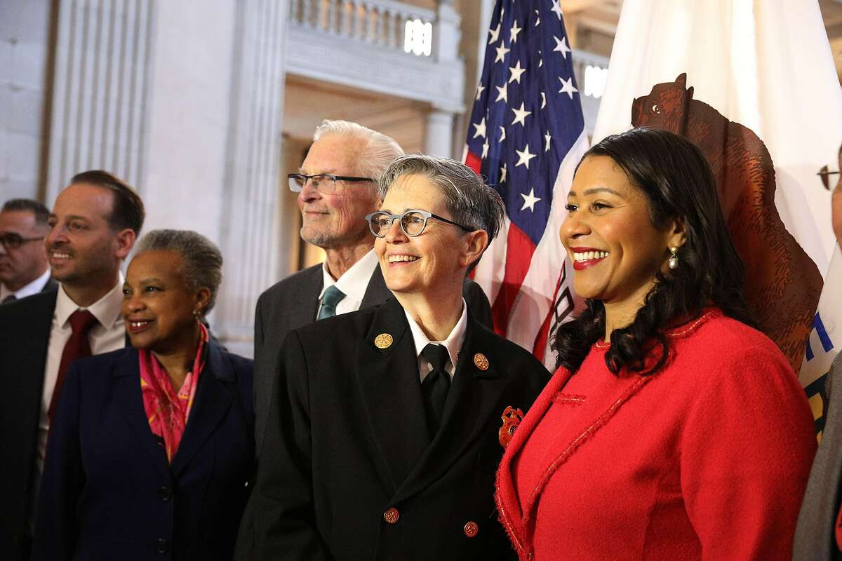Deputy Chief Jeanine Nicholson (second from right) and Mayor London Breed (right) stand with others after a news conference where Mayor Breed announced Nicholson as the new San Francisco Fire Chief on Wednesday, March 13, 2019 in San Francisco, Calif.