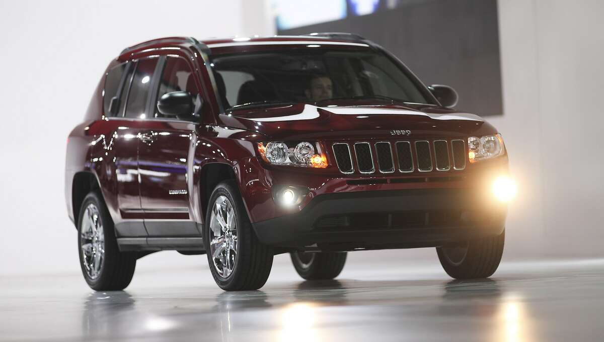(FILES) In this file photo taken on January 10, 2011 The restyled 2011 Jeep Compass is unveiled during the company's press conference at the North American International Auto Show in Detroit, Michigan. - Fiat Chrysler will recall nearly 863,000 SUVs and sedans that failed to meet federal emissions standards, US regulators announced March 13, 2019. The voluntary recall involves models of the Dodge Journey, Chrysler 200, Dodge Avenger and Dodge Caliber sedans as well as the Jeep Compass and Jeep Patriot SUVs produced for model years 2011 and 2016, according to a statement from the US Environmental Protection Agency. (Photo by GEOFF ROBINS / AFP)GEOFF ROBINS/AFP/Getty Images