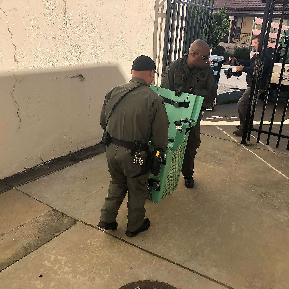 Workers at San Quentin State Prison remove pieces of California's dismantled death chamber Wednesday after Gov. Gavin Newsom ordered a halt to enforcement of the death penalty in the state.