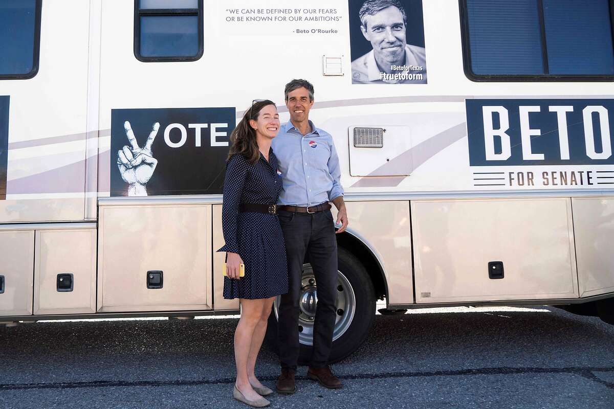 (FILES) In this file photo taken on November 6, 2018 Texas Senatorial Candidate Congressman Beto ORourke and his wife, Amy Hoover Sanders, are pictured in front of a campaign RV outside of Nixon Elementary School in El Paso, Texas. - Beto O'Rourke, the affable former congressman who rose to political stardom last year when he nearly ousted a Republican senator in traditionally conservative Texas, announced on March 14, 2019 he was running for the 2020 presidential race. (Photo by Paul Ratje / AFP)PAUL RATJE/AFP/Getty Images