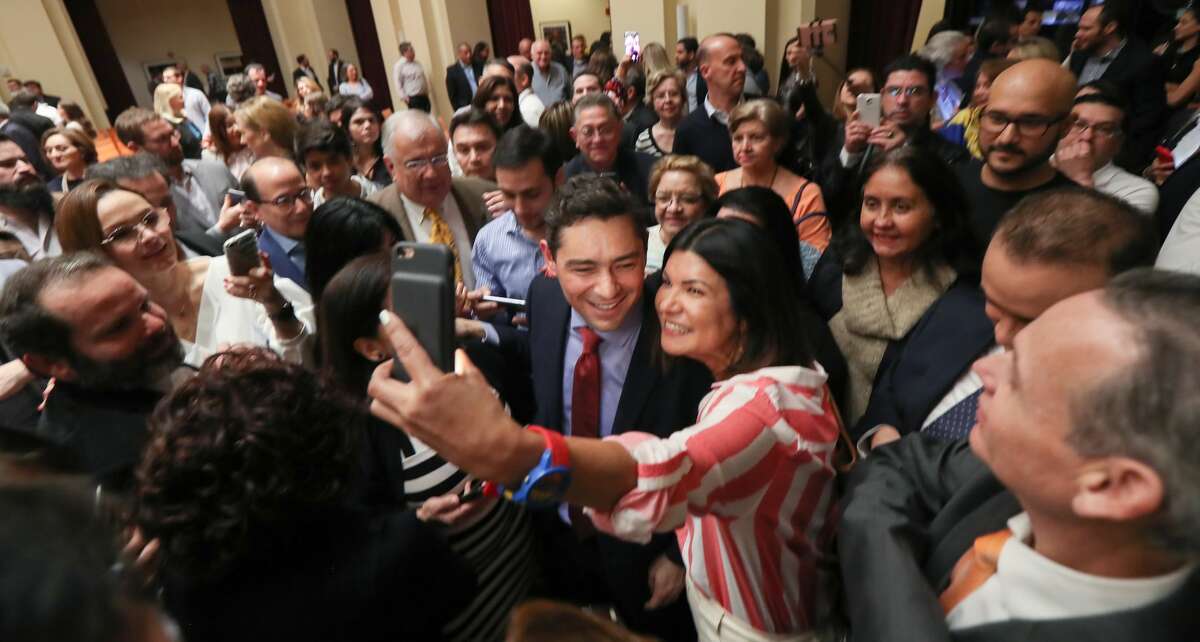 Venezuelan opposition ambassador Carlos Vecchio (center) was surrounded by well-wishers after addressing a large group of people at the James A. Baker III Institute for Public Policy on the campus of Rice University Wednesday, March 13, 2019, in Houston.