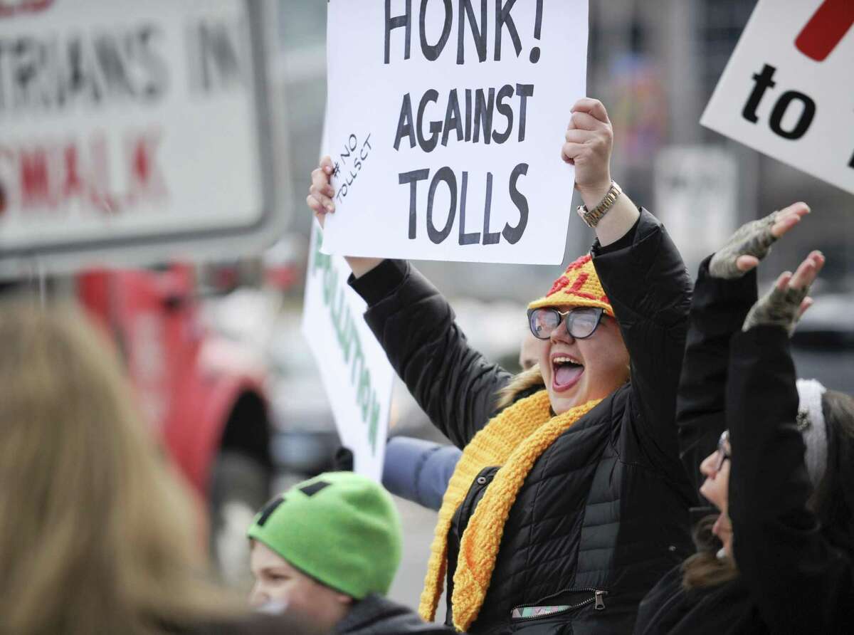 Hilary Gunn of Greenwich joins with approximately 100 activists from a anti-toll group No Tolls CT, as they stage a protest in front of the Government Center on Saturday, Feb. 23, 2019 in Stamford, Connecticut.