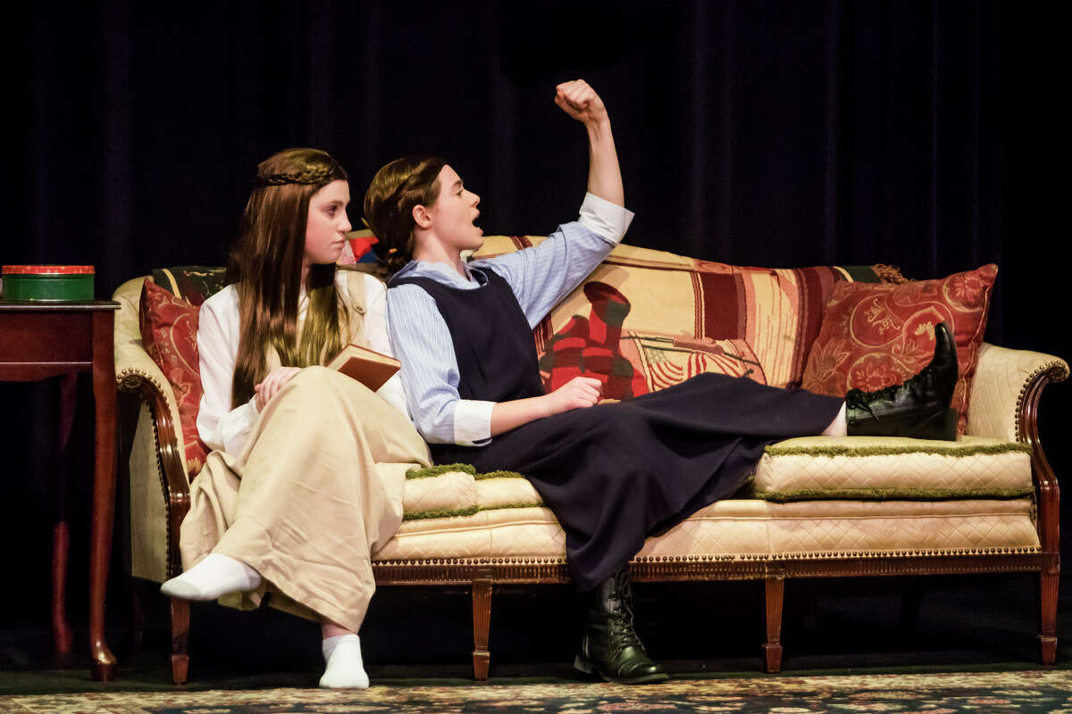 Adi Hyde in the role of Beth, left, and Sophie Hahn in the role of Jo, right, act out a scene during a dress rehearsal for Bullock Creek High School's production of "Little Women" on Wednesday, March 13, 2019 at Bullock Creek High School. (Katy Kildee/kkildee@mdn.net)