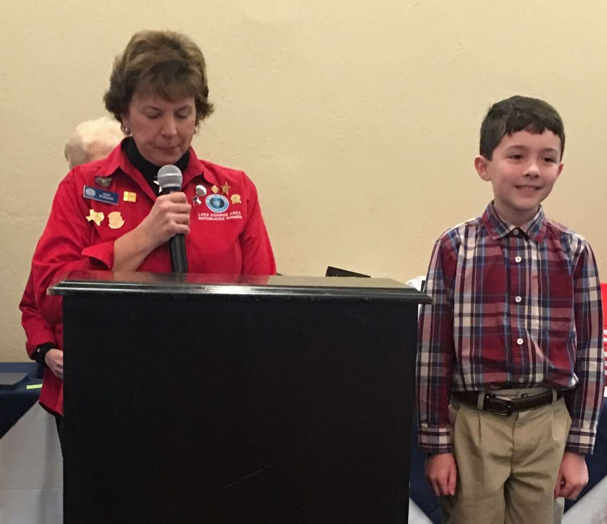 Lake Conroe Area Republican Women met recently at April Sound Country Club for the 2019 "My American Hero" Awards Luncheon. Fifteen third graders from Willis ISD and 20 fifth graders from Montgomery ISD were honored at this event for their essays describing who was his or her "American Hero" and why. Shown here is LCARW member Janis Boulware presenting Adian Glasglow (from Mel Parmley Elementary School) an award for his essay on President George Herbert Walker Bush.