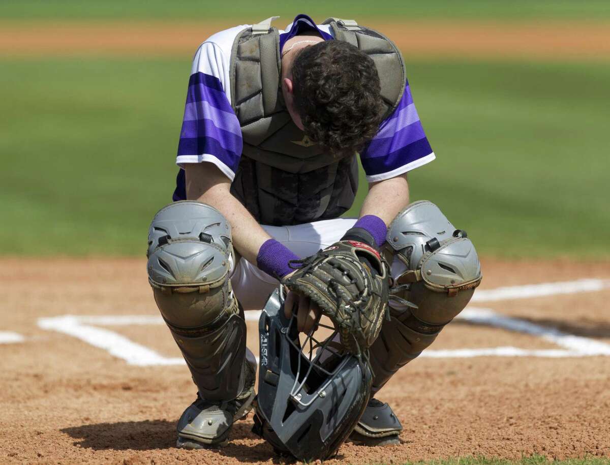 Montgomery catcher Grant Brown (9) prays before the first inning of a District 20-5A high school baseball game Thursday, March 14, 2019, in Montgomery.