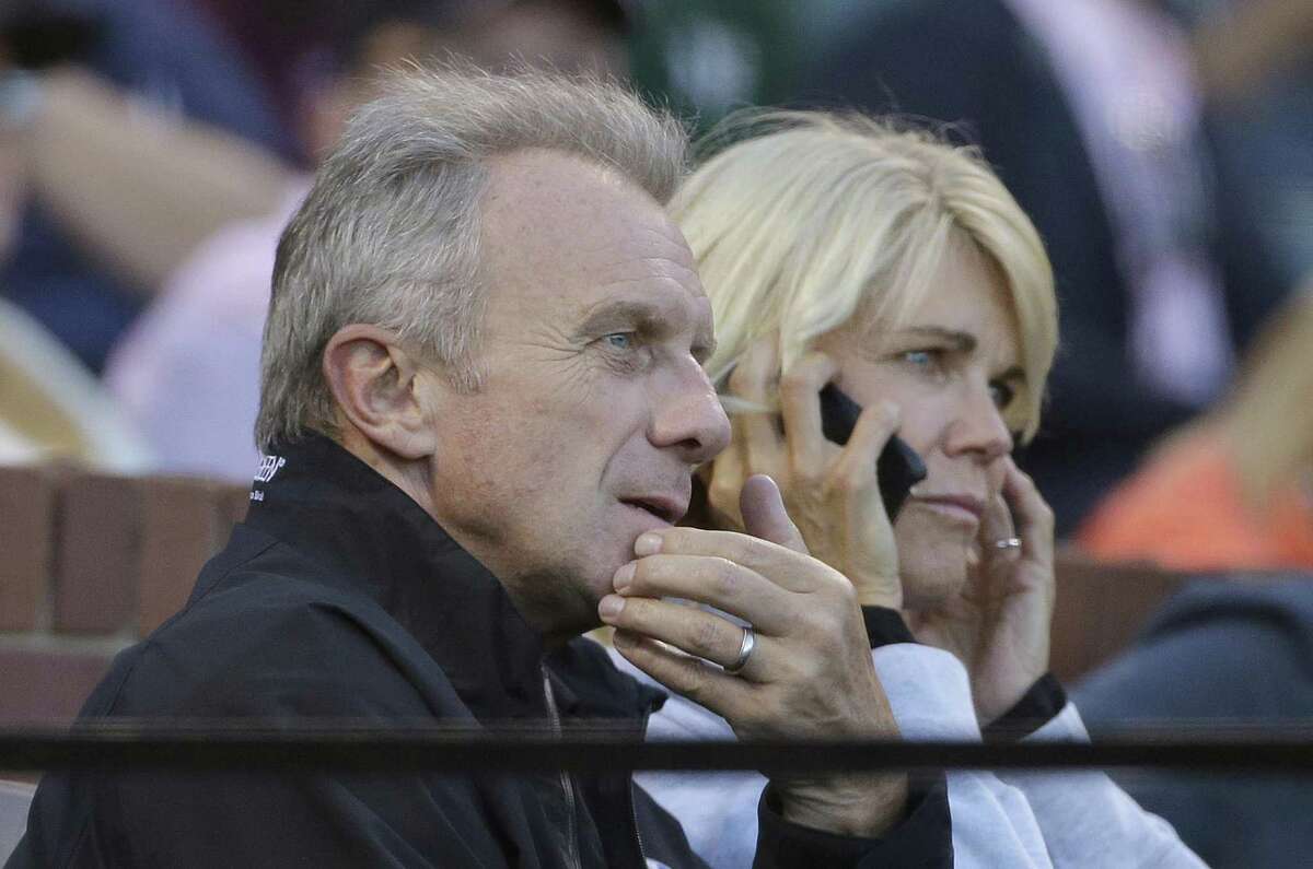 Hall of Fame football player Joe Montana, left, and his wife Jennifer watch during the third inning of a baseball game between the San Francisco Giants and the Oakland Athletics in San Francisco, Monday, June 27, 2016.