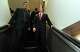 Bridgeport Mayor Joe Ganim rides down the escalator with State Rep. Ezequiel Santiago, left, Tuesday, Dec. 1, 2015, at the Margaret E. Morton Government Center. One of his first decisions in office was to restore power to the escalators which had been shut down to save electricity and encourage exercise during Bill Finch's administration.