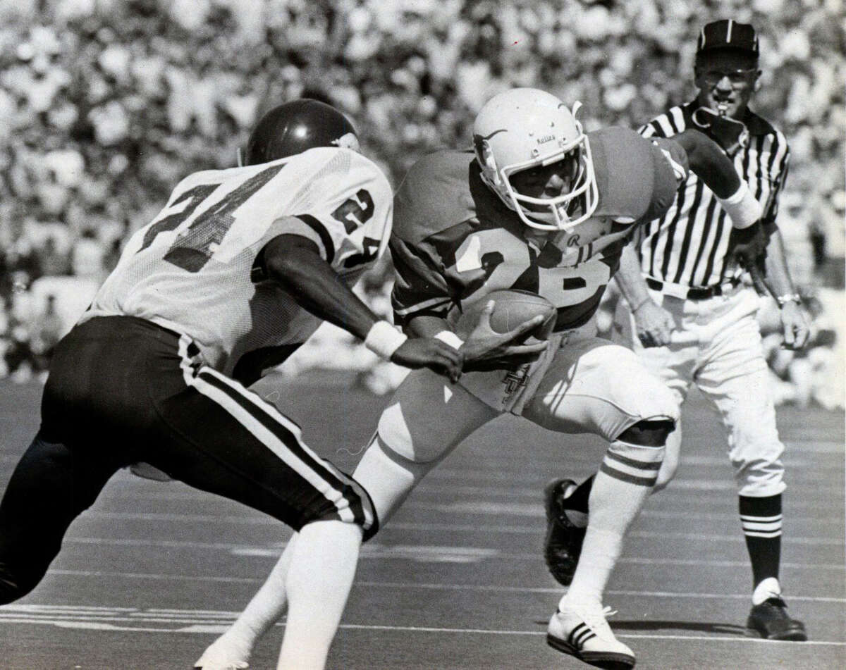 University of Texas two-sport athlete Johnny Jones is seen playing football in this undated Express-News file photo during his college career with the Longhorns.