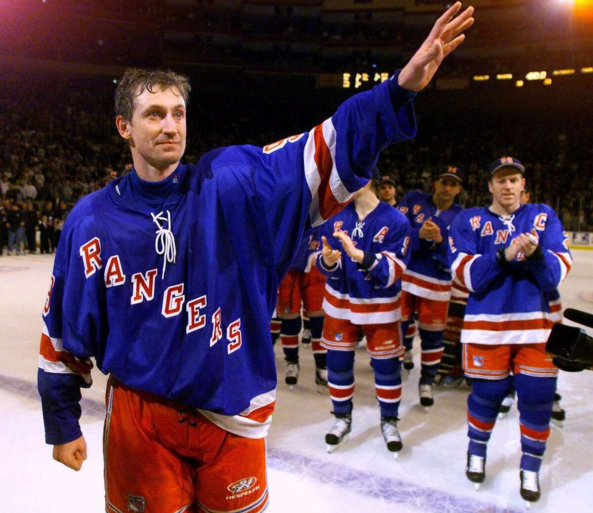 ADVANCE FOR WEEKEND EDITIONS SEPT. 25-26--FILE--New York Rangers' Wayne Gretzky leads his teammates around the ice during ceremonies following his last game in the NHL, April 18, 1999, in New York. The NHL may have a hard time topping the drama of the 1998-99 season, when Gretzky retired after a spectacular career and the Dallas Stars won a thrilling and controversial Stanley Cup series over the Buffalo Sabres. (AP Photo/Paul Chiasson)