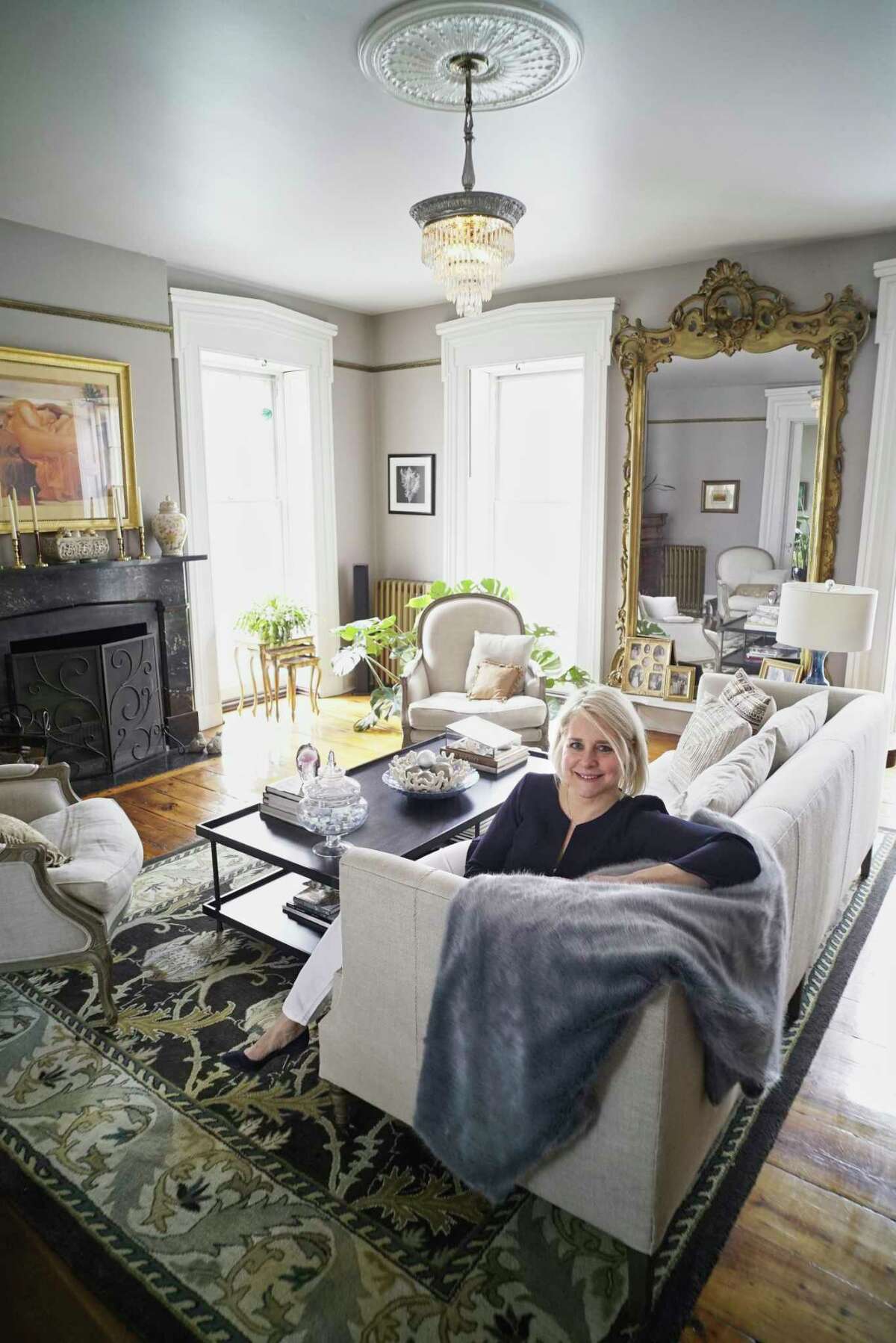 Stephanie Pettit poses for a photo in the living room at her home on Tuesday, March 12, 2019, in Troy, N.Y. (Paul Buckowski/Times Union)