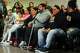 Members of state Rep. Ezequiel Santiago’s family sit during a moment of silence at the Morton Government Center, in Bridgeport, Conn. March 15, 2019. Santiago died overnight at the age of 45.