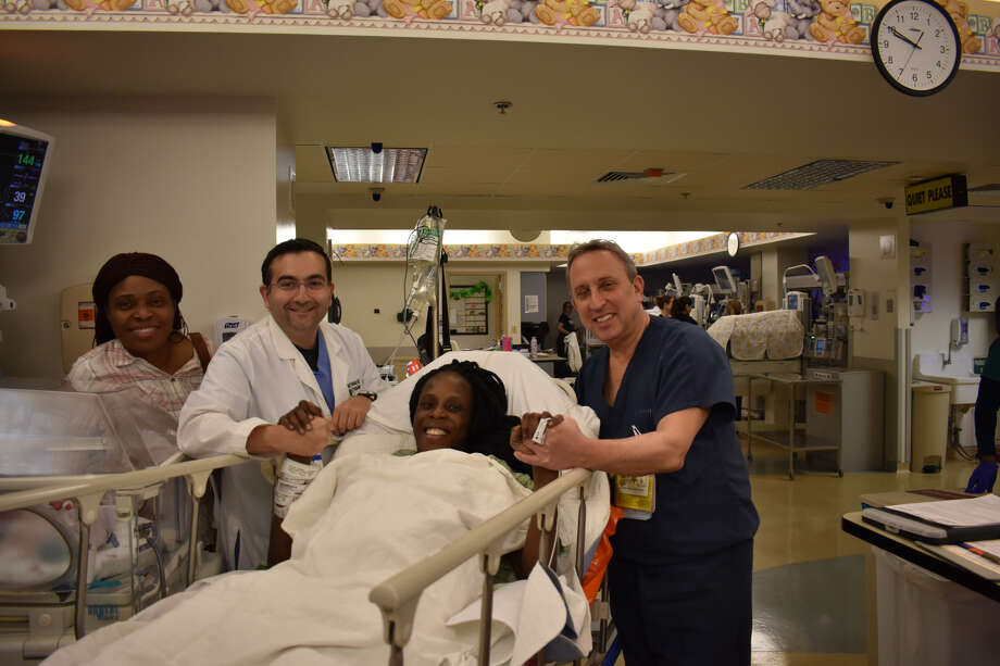 Thelma Chiaka with, from left, relative Ebere Ofor, Dr. Ziad Haidar, the perinatologist who delivered the babies and neonatologist Dr. Israel Simchowit, both on-staff at The Woman’s Hospital of Texas. >>What were Houston parents naming their kids last year? Find out in the photos that follow... Photo: The Woman's Hospital Of Texas