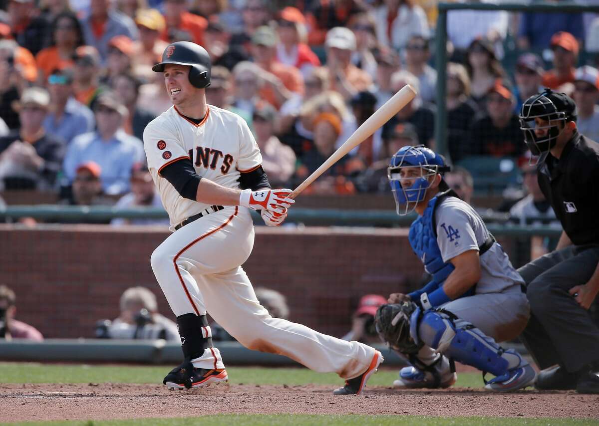 Giants' Buster Posey, 28 doubles in the sixth inning to score JOe Panik, 12 and give the Giants a 7-4 lead, as the San Francisco Giants take on the Los Angeles Dodgers during their home opener of the 2016 MLB season, at AT&T Park in San Francisco, California on Thurs. April 7, 2016.
