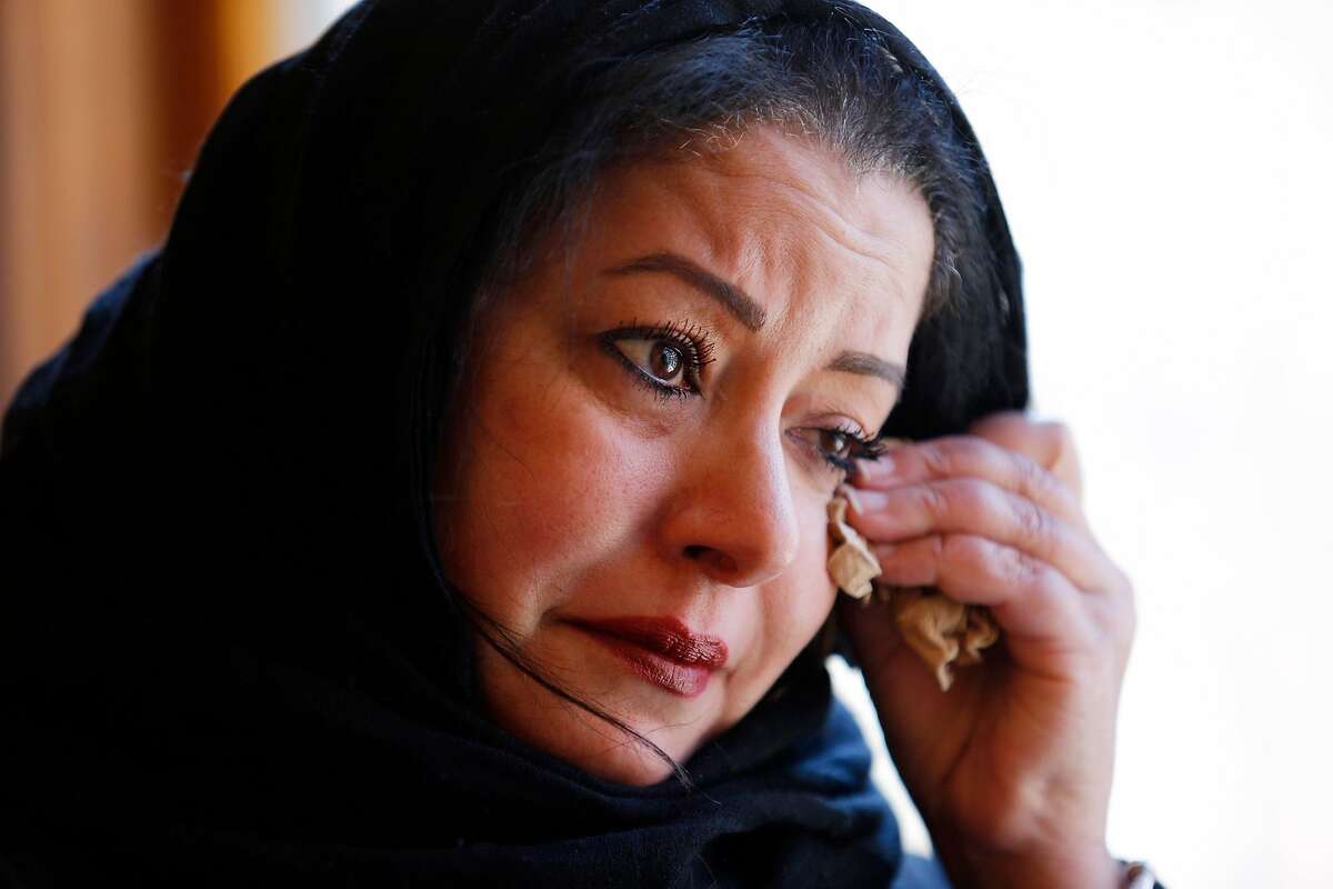 San Francisco Human Rights commissioner Hala Hijazi cries at the Darussalam Mosque on Friday, March 15, 2019, in San Francisco.