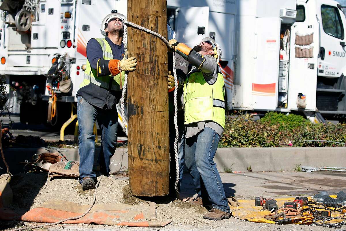 A Sacramento Municipal Utility District installation crew replaces a utility pole on Fairfield Street in Sacramento, Calif. on Friday, March 15, 2019. SMUD is one of the largest publicly operated electric utility companies in Northern California.