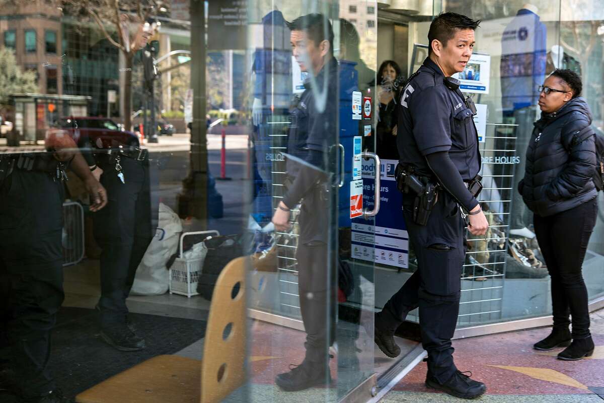 Oakland Police officers patrol along Broadway Avenue in Oakland, Calif. Wednesday, March 13, 2019.