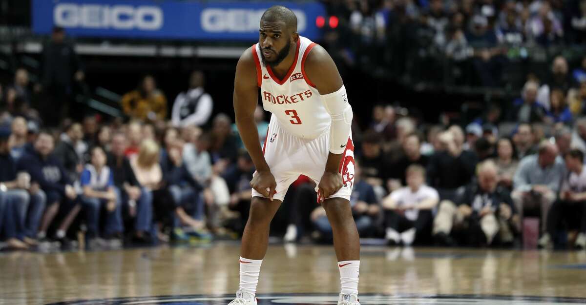 Houston Rockets guard Chris Paul (3) watches as free throws are taken during an NBA basketball game against the Dallas Mavericks in Dallas, Sunday, March 10, 2019. (AP Photo/Tony Gutierrez)