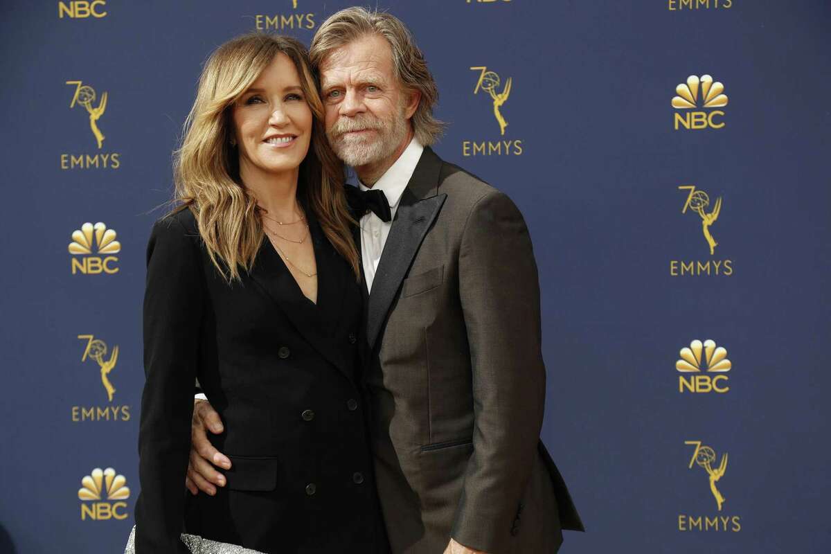 Felicity Huffman and William H. Macy arrive at the 70th Primetime Emmy Awards at the Microsoft Theater in Los Angeles on Monday, Sept. 17, 2018. (Marcus Yam/Los Angeles Times/TNS)