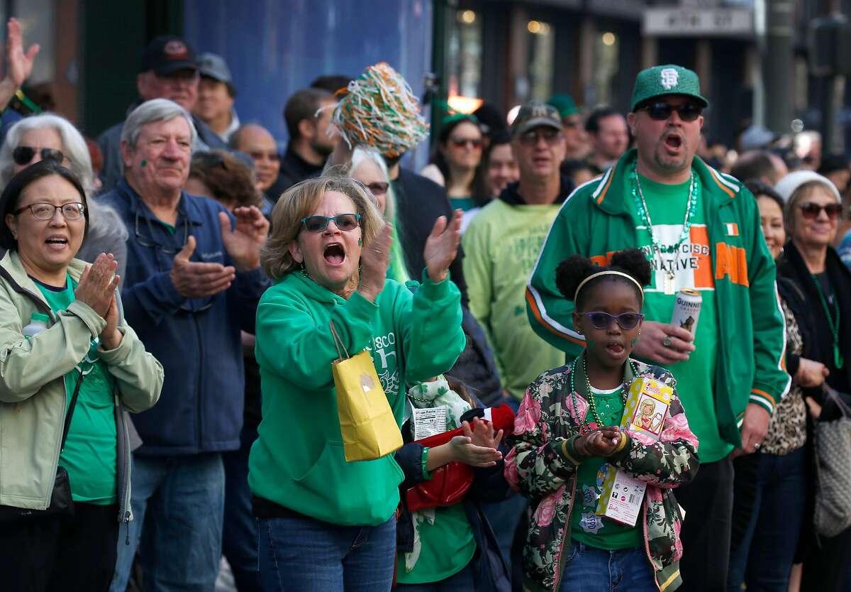 The crowd cheers as participants perform in the annual St. Patrick's Day Parade on Market Street in San Francisco, Calif. on Saturday, March 16, 2019.