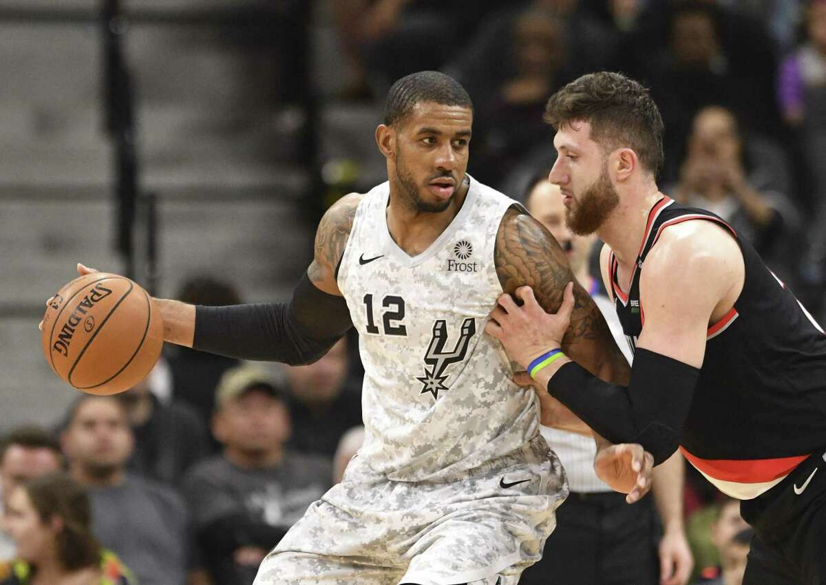 LaMarcus Aldridge, left, is accustomed to muscling his way inside against the likes of the Blazers’ Jusuf Nurkic, but the Spurs need his outside shooting.