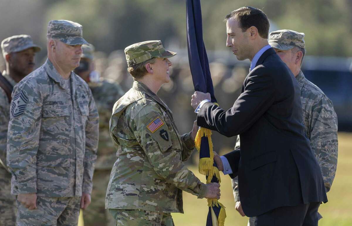 Maj. Gen. Tracy R. Norris receives the Texas Military Department flag from Secretary of State David Whitley as she becomes the adjutant general of the Texas National Guard during the change-of-command ceremony at Camp Mabry on Jan. 12, 2019.