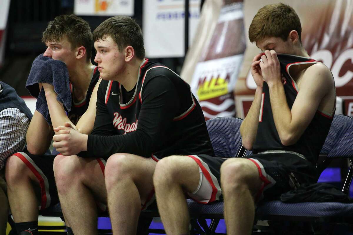 Oppenheim-Ephratah/St. Johnsville players react after their Class D final loss to Harrisville on Sunday in Binghamton. (Erin Reid Coker/Special to the Times Union)