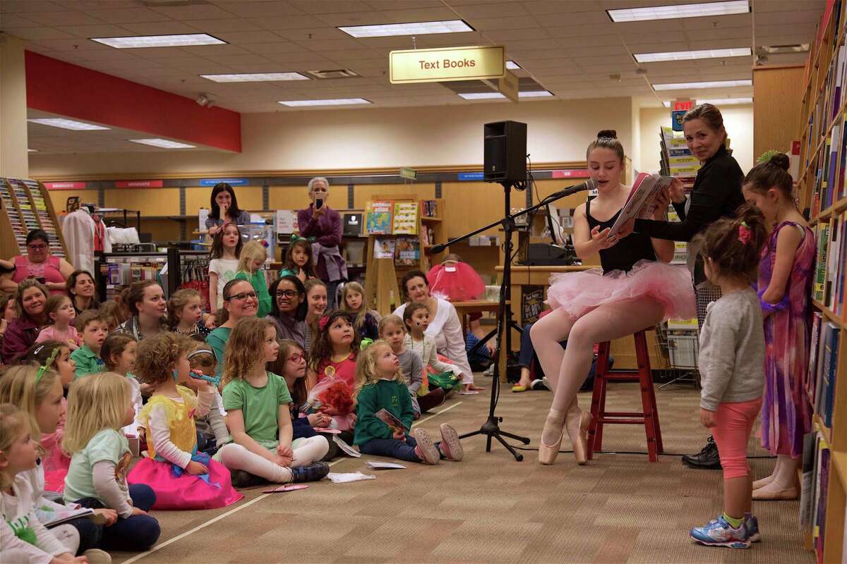 Isabel Brenner, 13, of Fairfield, reads the story to kids at the ballet story time at Fairfield University Bookstore on Friday, March 15, 2019, in Fairfield, Conn.