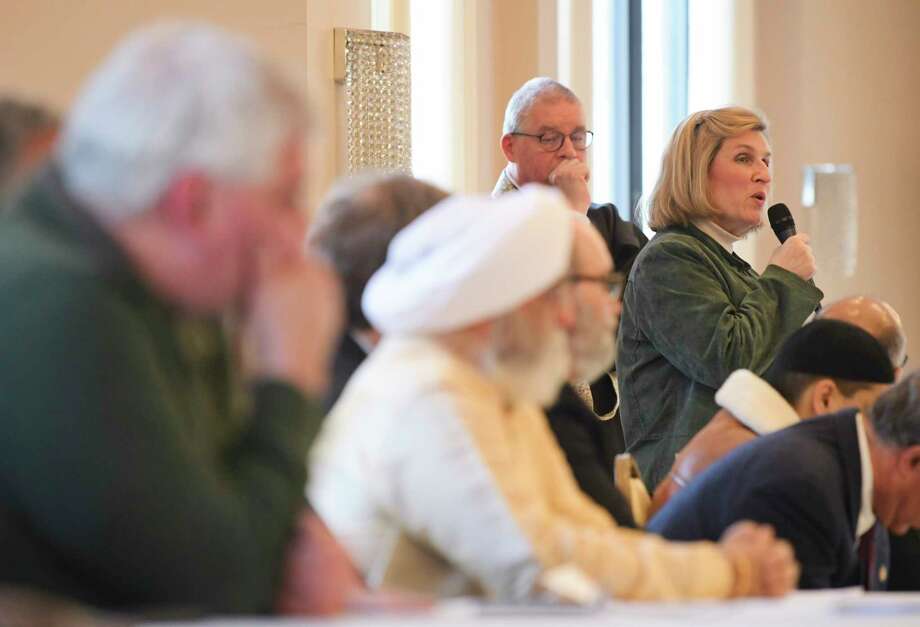 The Rev. Kathy Donley with Emmanuel Baptist Church in Schenectady, addresses people of all faiths who gathered at The Islamic Center of the Capital District for a vigil for the victims of Friday's massacres at two mosques in New Zealand on Sunday, March 17, 2019, in Schenectady, N.Y.    (Paul Buckowski/Times Union) Photo: Paul Buckowski, Albany Times Union / (Paul Buckowski/Times Union)