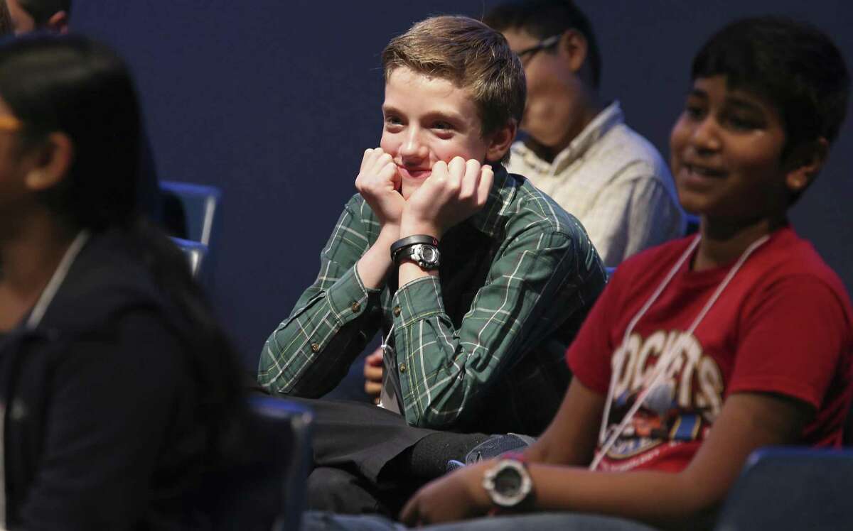 Christian Hurlin, 13, smiles during the 66th annual Express-News Spelling Bee on March 17, 2019.
