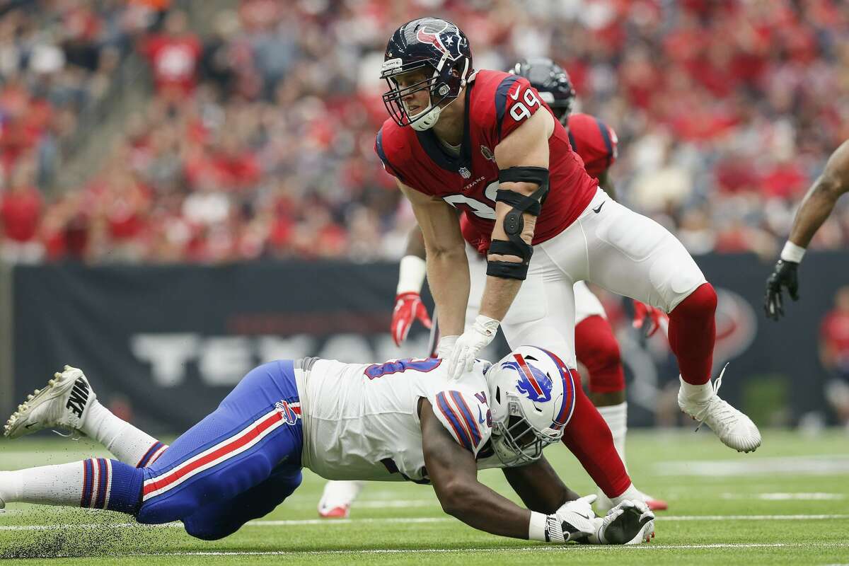 HOUSTON, TX - OCTOBER 14: J.J. Watt #99 of the Houston Texans avoids a block by Jordan Mills #79 of the Buffalo Bills in the first half at NRG Stadium on October 14, 2018 in Houston, Texas. (Photo by Tim Warner/Getty Images)