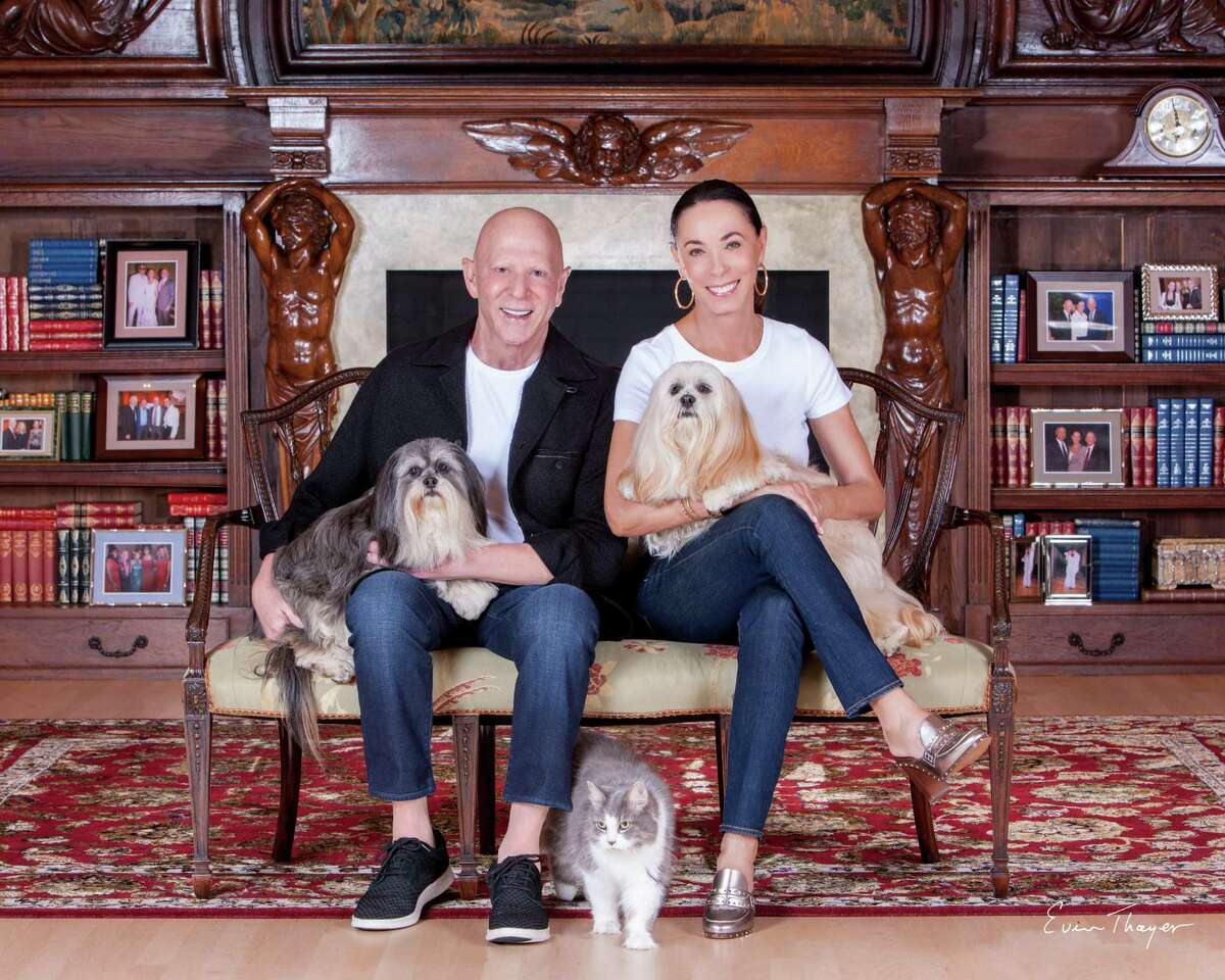 Lester and Sue Smith pose at home with their beloved pets.