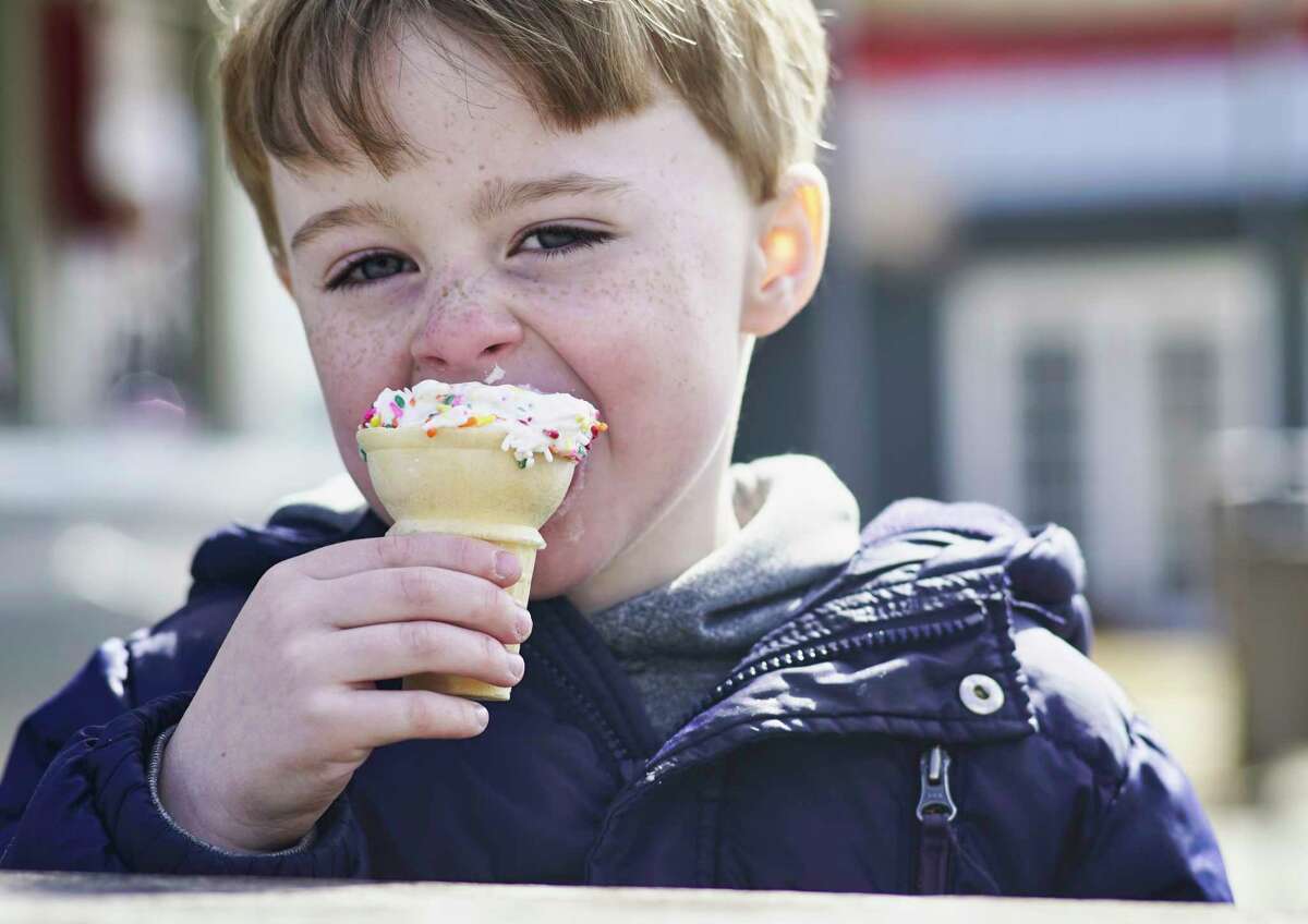 Nathan Eliea-Shields, 4, from Feura Bush enjoys an ice cream cone during opening day at Kurver Kreme on Monday, March 18, 2019, in Albany, N.Y. (Paul Buckowski/Times Union)