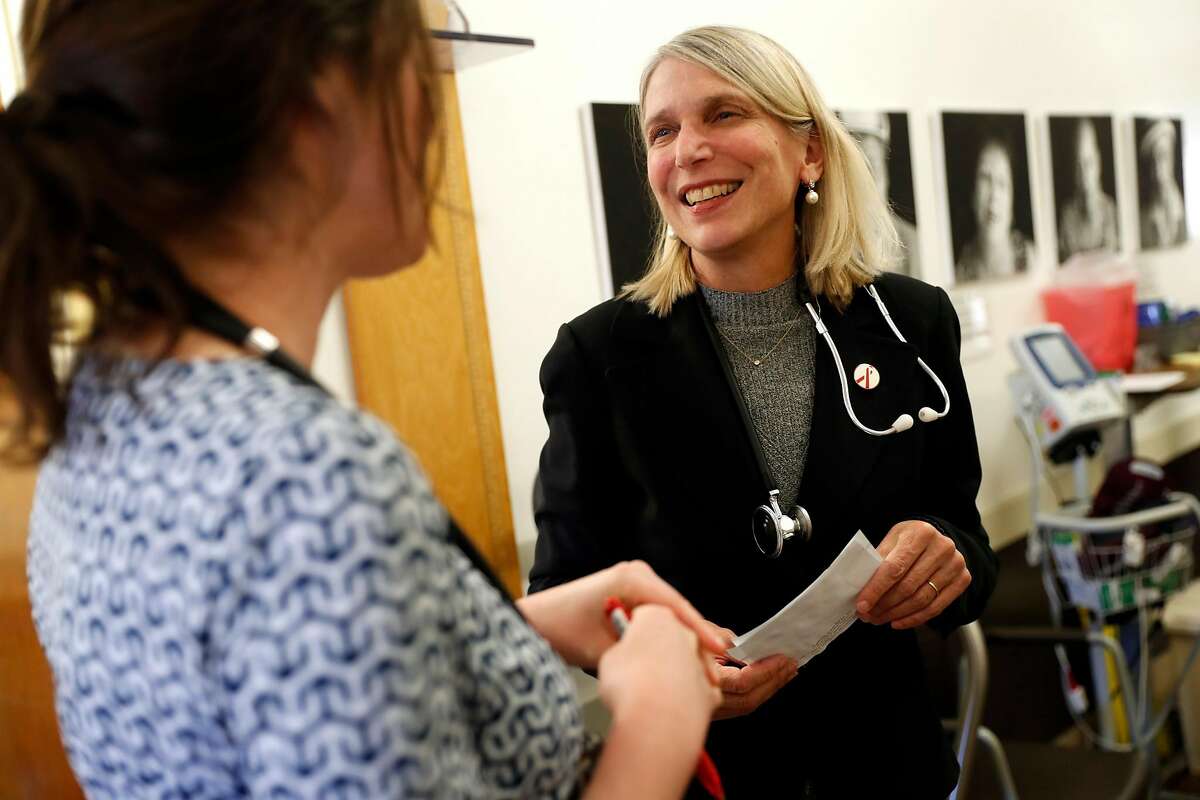 Dr. Diane Havlir (right) and Dr. Elizabeth Imbert chat at San Francisco General Hospital's HIV/AIDS clinic in San Francisco, Calif., on Thursday, March 14, 2019.