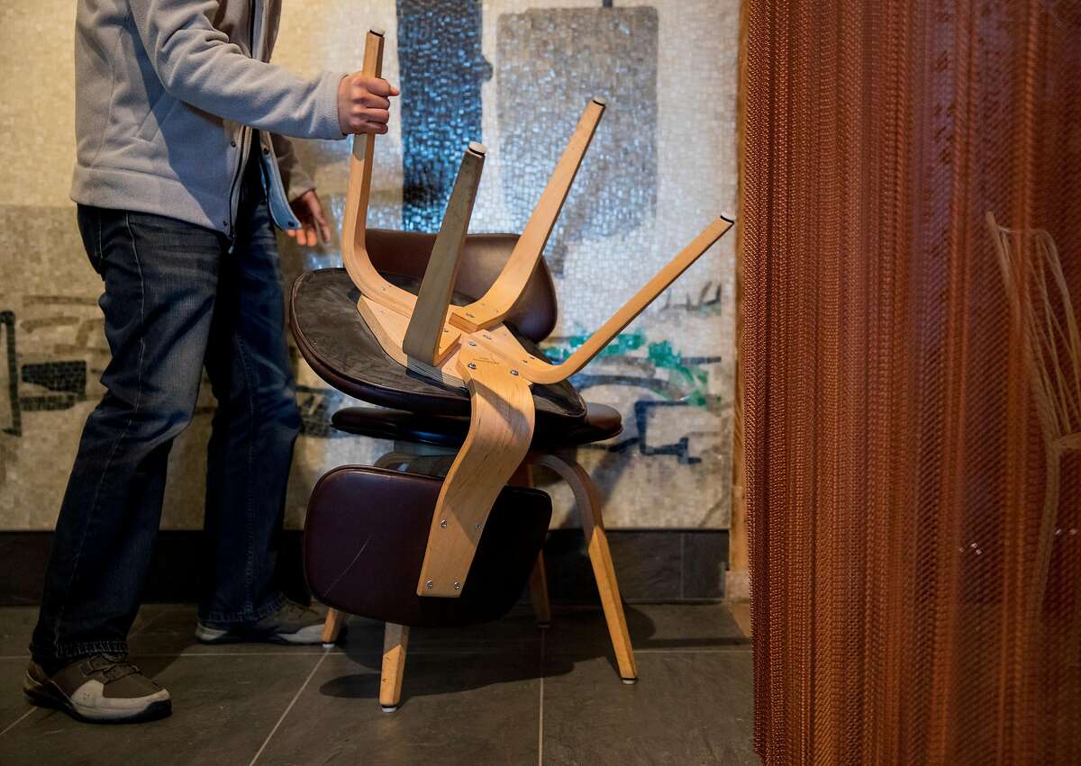 Palette Tea House manager Dennis Leung displays the chairs originally used by the restaurant that were deemed unfit by a fire inspector while at Palette Tea House located inside Ghirardelli Square in San Francisco Calif. Friday, March 15, 2019.