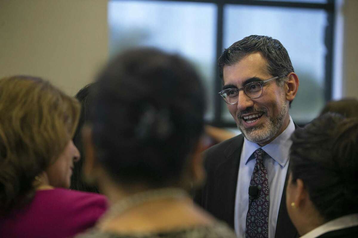 Mike Flores meets with attendees at a Hispanic Chamber luncheon last October, shortly after his appointment as Chancellor of the Alamo Colleges.