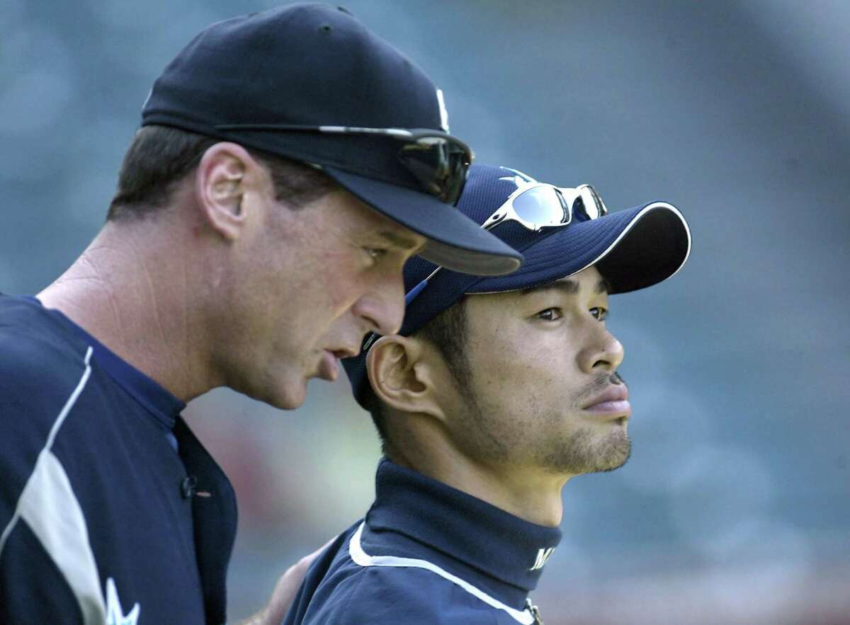 ANAHEIM, CA - JUNE 26: Ichiro Suzuki #51 of the Seattle Mariners listens to his manager Bob Melvin during batting practice before their game with the Anaheim Angels on June 26, 2003 at Edison Field in Anaheim, California. (Photo by Stephen Dunn/Getty Images)