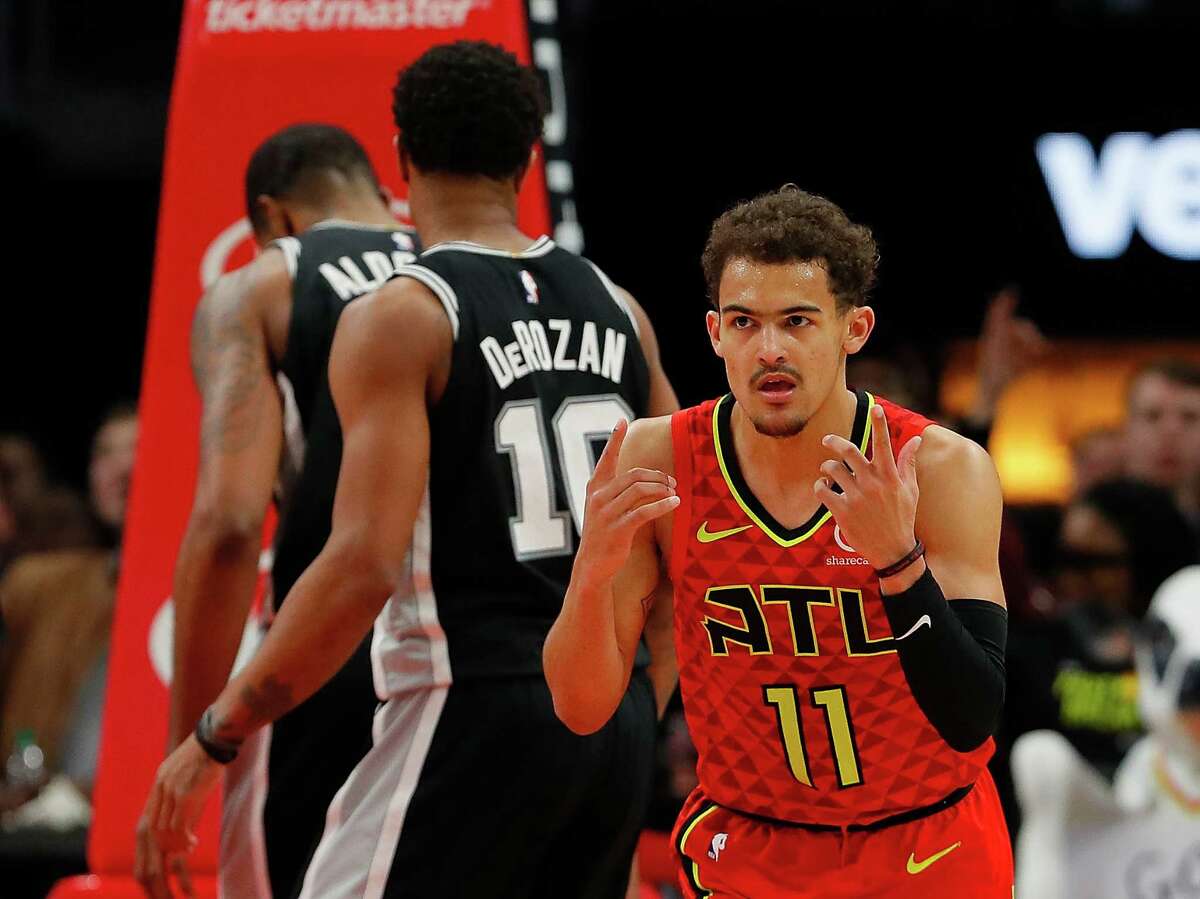 ATLANTA, GEORGIA - MARCH 06: Trae Young #11 of the Atlanta Hawks reacts after a basket against the San Antonio Spurs in the second half at State Farm Arena on March 06, 2019 in Atlanta, Georgia. NOTE TO USER: User expressly acknowledges and agrees that, by downloading and or using this photograph, User is consenting to the terms and conditions of the Getty Images License Agreement.